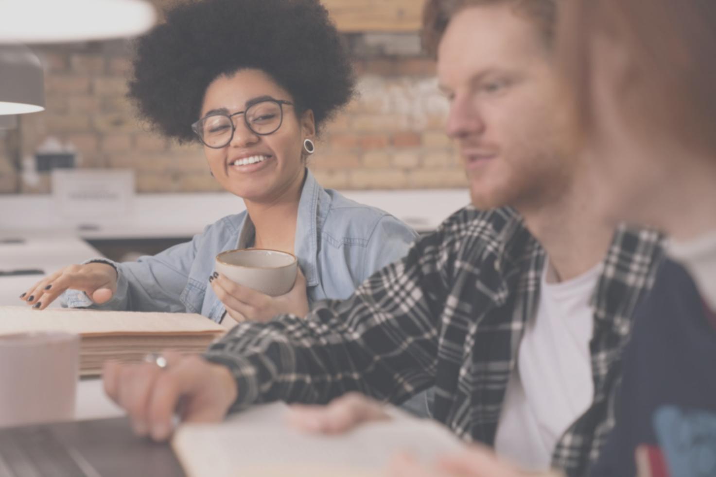 Financial analyst reviewing market data on multiple screens in modern office environment